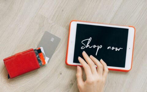 Close-up of a digital shopping theme with a tablet and credit cards, highlighting a modern retail experience.